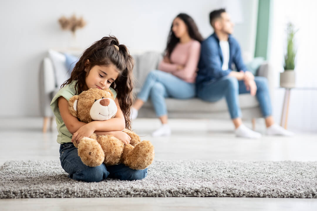 A little girl upset following the quarrel between her parents