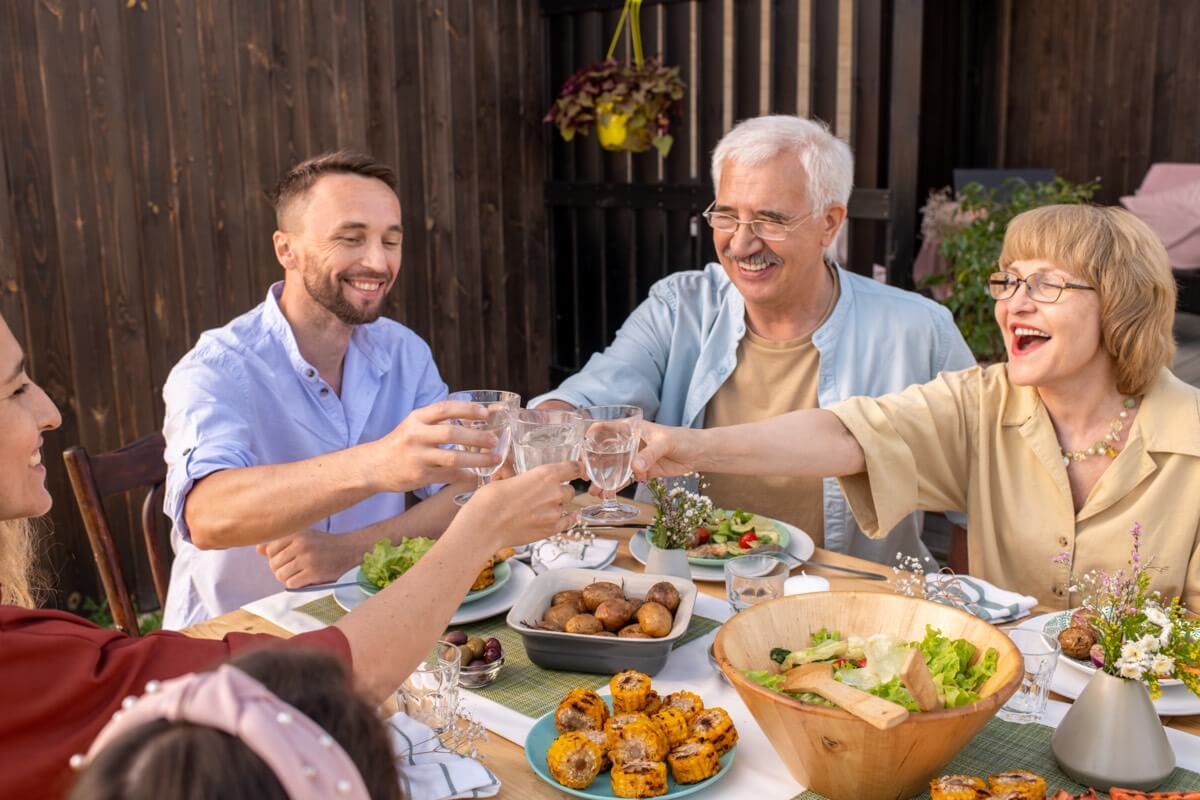 A family clinking glasses at a family celebration or birthday